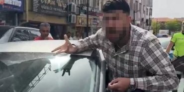 Kendisini uyaran polisin üzerine otomobilini sürdü