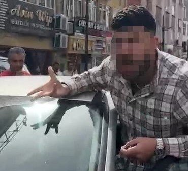 Kendisini uyaran polisin üzerine otomobilini sürdü